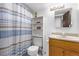 Clean bathroom with shower/tub combo, toilet, and vanity at 381 S Ames St # B103, Lakewood, CO 80226