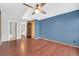 Spacious bedroom with wood-look floors and ceiling fan at 9644 W Cornell Pl, Lakewood, CO 80227