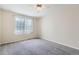 Bright bedroom with neutral walls and carpet at 12965 Lafayette St # F, Thornton, CO 80241