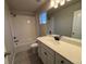 Clean bathroom with tub, shower and vanity at 2778 Optimista Pl, Brighton, CO 80601