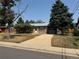 Brick ranch house with attached garage and yard at 476 Zion St, Aurora, CO 80011