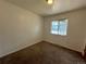 Well-lit bedroom with neutral walls and carpeting at 476 Zion St, Aurora, CO 80011