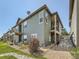 Well-maintained home exterior with landscaping and private deck at 16579 W 86Th Pl # B, Arvada, CO 80007