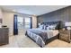 Main bedroom with a stylish dresser and calming blue color scheme at 6621 N Ceylon St, Denver, CO 80249