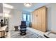 Cozy office space features a comfortable recliner and built-in Murphy bed at 6621 N Ceylon St, Denver, CO 80249