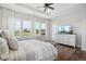 Bright bedroom with large windows, a dresser, and a comfortable bed at 25851 E Clifton Pl, Aurora, CO 80016