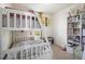 Bedroom with bunk beds and plenty of book storage at 25954 E 1St Pl, Aurora, CO 80018