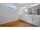 Bathroom boasts double vanity, a large mirror, and a walk-in shower at 3452 N Gold Bug Ct, Aurora, CO 80019