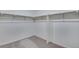 Large walk-in closet with double rods and grey carpet at 3452 N Gold Bug Ct, Aurora, CO 80019