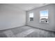 Simple bedroom with grey carpet and two large windows at 3452 N Gold Bug Ct, Aurora, CO 80019