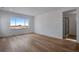 Spacious bedroom with hardwood floors and a large window with a view at 3452 N Gold Bug Ct, Aurora, CO 80019