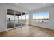 Spacious office with hardwood floors and sliding glass doors leading to a patio at 3452 N Gold Bug Ct, Aurora, CO 80019