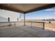 Covered patio with white railings offering views of the surrounding area at 3452 N Gold Bug Ct, Aurora, CO 80019