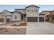 Two-story home with gray siding and stone accents at 3452 N Gold Bug Ct, Aurora, CO 80019