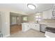 Modern kitchen with white cabinets, quartz countertops and stainless steel appliances at 2866 E Euclid Pl, Centennial, CO 80121