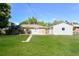 Large backyard with detached garage and grassy lawn at 2866 E Euclid Pl, Centennial, CO 80121