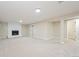 Spacious finished basement with fireplace and neutral carpeting at 2866 E Euclid Pl, Centennial, CO 80121