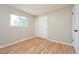 Hardwood floor bedroom with double closet and window at 2866 E Euclid Pl, Centennial, CO 80121
