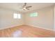 Bright bedroom with hardwood floors and ceiling fan at 2866 E Euclid Pl, Centennial, CO 80121