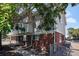 Another view of the duplex with a walkway and fence at 4463 Adams St, Denver, CO 80216