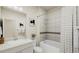 Clean bathroom with tub/shower combo and neutral tile at 1552 E 3Rd Ave, Longmont, CO 80501