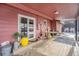 Covered patio with glass-top table and access to backyard at 907 Elm Ct, Fort Lupton, CO 80621