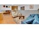 Spacious basement Gathering room with comfortable seating and a fireplace at 6765 S Adams Way, Centennial, CO 80122