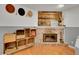 Cozy basement area with a brick fireplace and wood accent wall at 6765 S Adams Way, Centennial, CO 80122