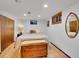 Spacious finished basement bedroom with large bed and wood storage chest at 6765 S Adams Way, Centennial, CO 80122