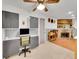 Finished basement with fireplace, built-in shelving and workspace at 6765 S Adams Way, Centennial, CO 80122