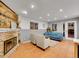 Finished basement features a fireplace and comfortable seating area at 6765 S Adams Way, Centennial, CO 80122