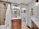 Updated bathroom with a modern vanity and shower/tub combo at 6765 S Adams Way, Centennial, CO 80122
