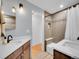 Clean bathroom, double vanity, tub, shower at 6765 S Adams Way, Centennial, CO 80122