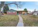 Brick ranch home with covered porch and walkway at 6765 S Adams Way, Centennial, CO 80122