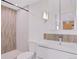 Clean bathroom with single vanity, toilet, and shower at 4875 S Monaco St # 408, Denver, CO 80237