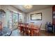 Bright dining room featuring a bay window and a wine cooler at 11416 Newport St, Thornton, CO 80233