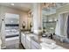 Elegant bathroom with double vanity and large walk-in shower at 1131 Sugarloaf Ln, Erie, CO 80516