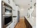 Modern kitchen with stainless steel appliances and white shaker cabinets at 2905 W 4Th Ave, Denver, CO 80219