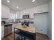 Modern kitchen with stainless steel appliances and granite countertops at 45028 Sunflower Ln, Bennett, CO 80102