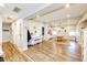 Open concept dining room with hardwood floors and a piano at 1042 Buttercup Rd, Elizabeth, CO 80107