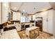 Spacious kitchen featuring white cabinets, stainless steel appliances, and a farmhouse sink at 1042 Buttercup Rd, Elizabeth, CO 80107