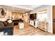 Spacious living room with farmhouse decor and hardwood floors at 1042 Buttercup Rd, Elizabeth, CO 80107