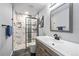 Modern bathroom with marble shower and vanity at 5562 Rim View Pl, Parker, CO 80134