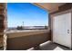 Private balcony with view of surrounding area and door access at 875 E 78Th Ave # 67, Denver, CO 80229