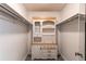 Large walk-in closet with built-in shelving and hanging rods at 2790 S Wheeling Way, Aurora, CO 80014