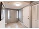 Bright entryway with light grey walls and wood-look flooring at 2790 S Wheeling Way, Aurora, CO 80014