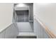 Basement stairs with gray walls and carpet at 2790 S Wheeling Way, Aurora, CO 80014