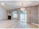 Living room with hardwood floors, fireplace and sliding door to patio at 2790 S Wheeling Way, Aurora, CO 80014