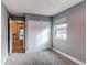 Simple bedroom with gray walls, carpet, and sliding closet doors at 2790 S Wheeling Way, Aurora, CO 80014
