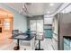 Modern kitchen with stainless steel appliances and updated cabinetry at 2790 S Wheeling Way, Aurora, CO 80014